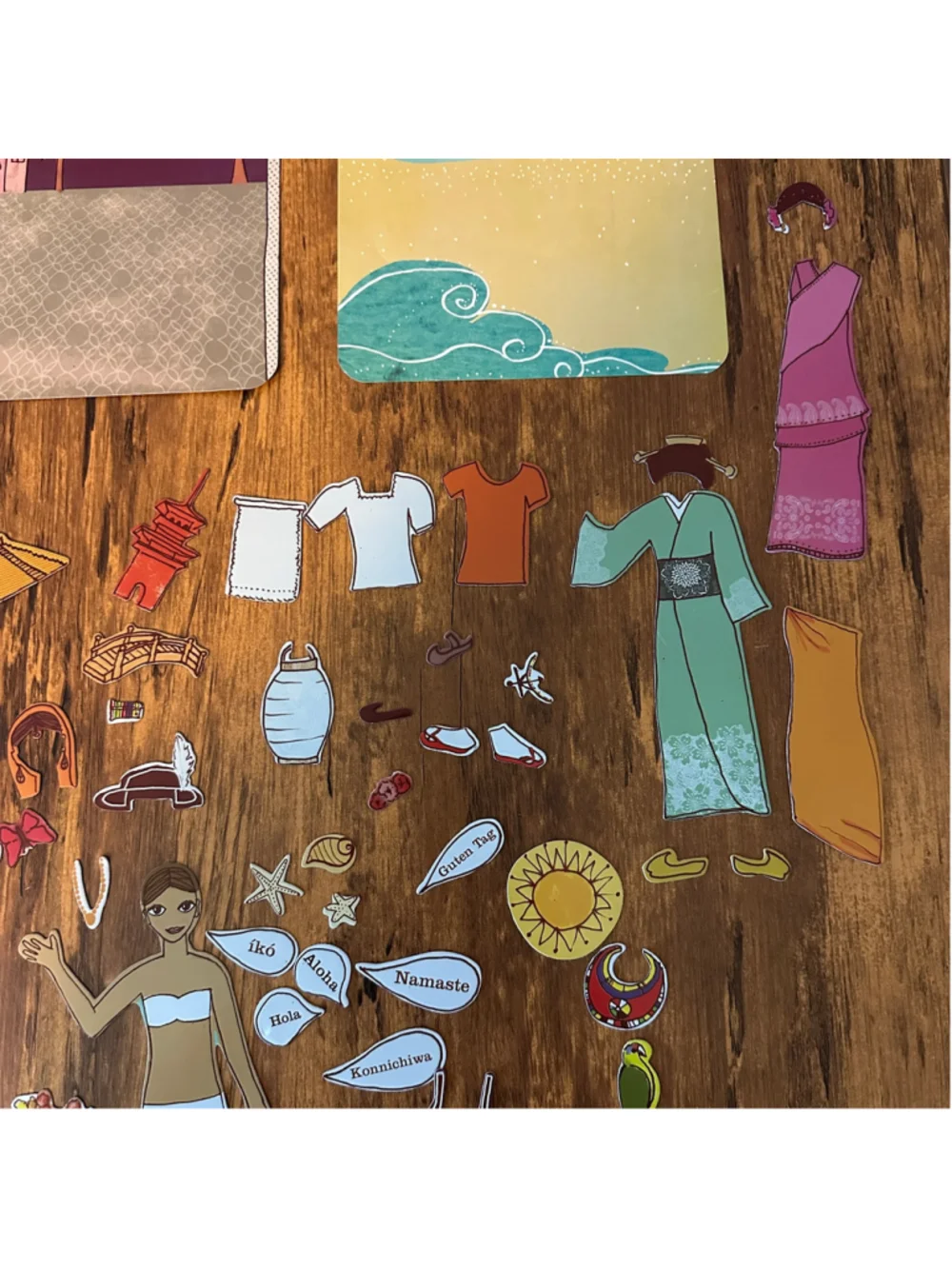 Mudpuppy World Traveler Magnetic Dress Up Doll Set Tin Clothing Accessories